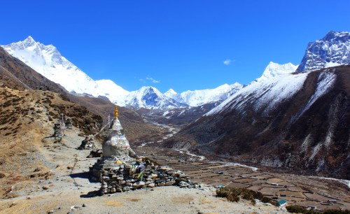 Chortens and Stupas above Dingboche. Island Peak, 6,183 metres sits in the bowl at the head of the valley.
