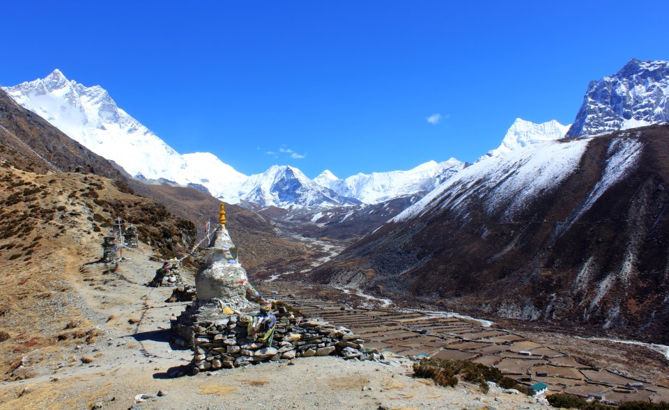 Chortens and Stupas above Dingboche. Island Peak, 6,183 metres sits in the bowl at the head of the valley.