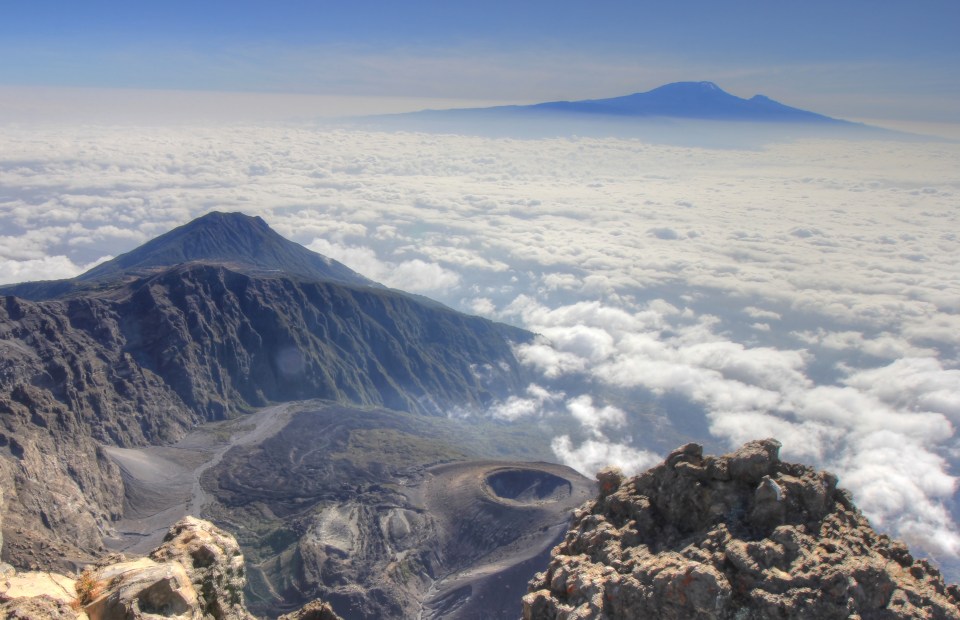 The view from Meru summit with Little Meru, Rhino Point, the Ash cone and Kilimanjaro all visible.