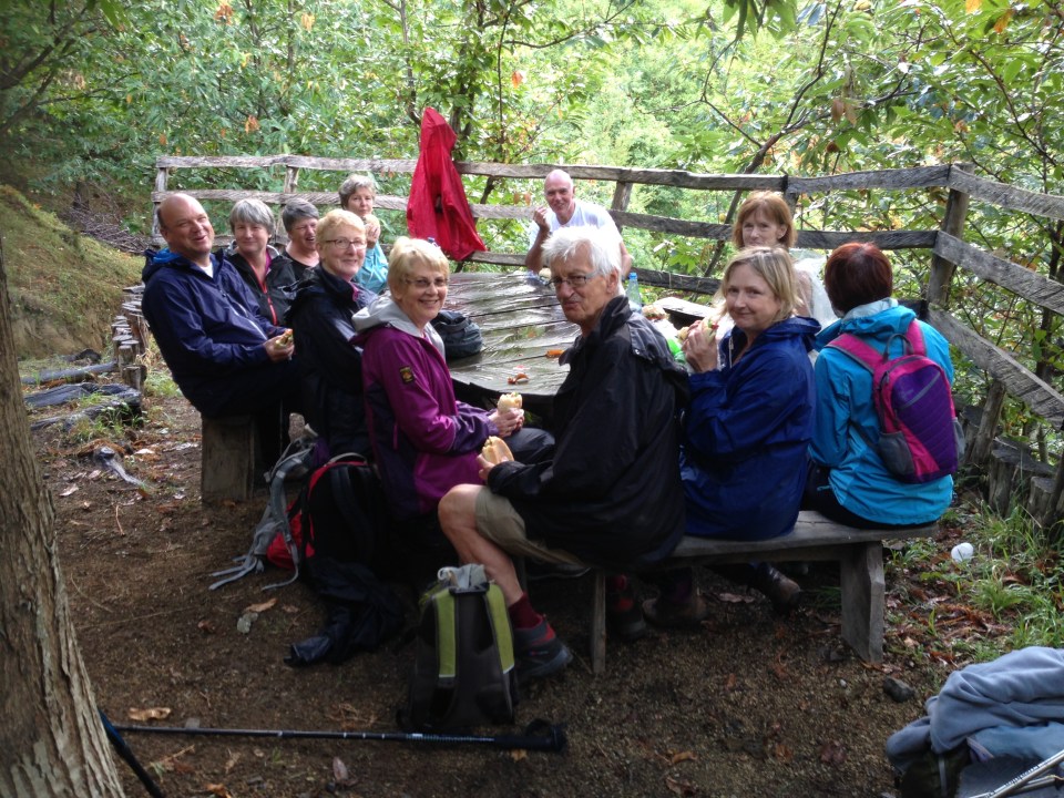 The team enjoying their lunch after the rain.