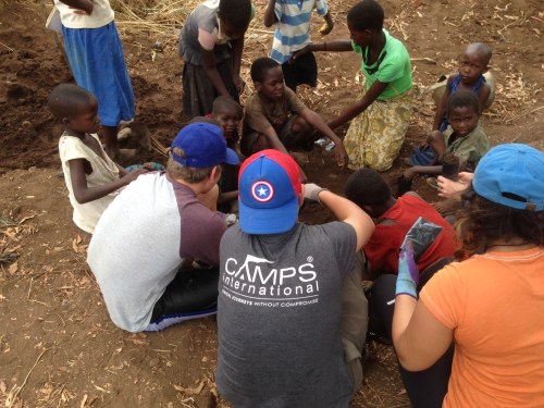 Students from American School of Dubai help to plant trees that will fix nitrogen into local farmer's fields.